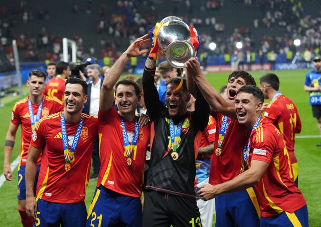 Spain’s Mikel Merino, Mikel Oyarzabal, Alejandro Remiro, Robin Le Normand and Martin Zubimendi celebrate with the Euro 2024 trophy