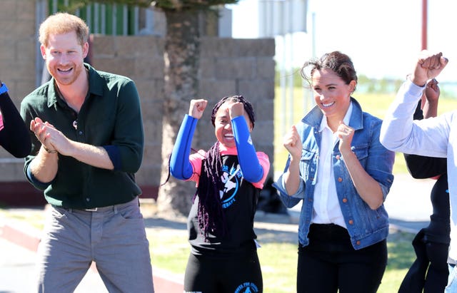 The Duke and Duchess of Sussex with surf mentors during a visit to Waves for Change at Monwabisi Beach in Cape Town, on day two of their tour of Africa.