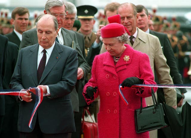 The Queen and President Francois Mitterrand of France cut the ribbon to officially open the Channel tunnel (Tim Ockenden/PA)
