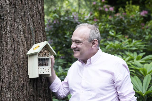 Liberal Democrats leader Sir Ed Davey with an insect hotel during a visit to Whinfell Quarry Gardens, Sheffield