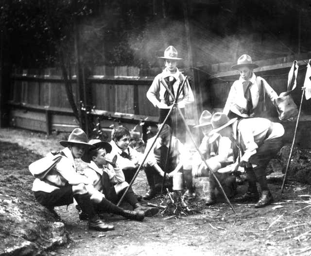 Boy Scouts round a fire