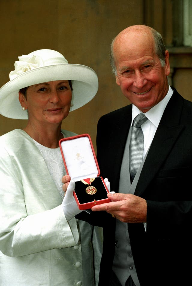 Charlton and his wife Lady Norma with his knighthood, which he received in 1994