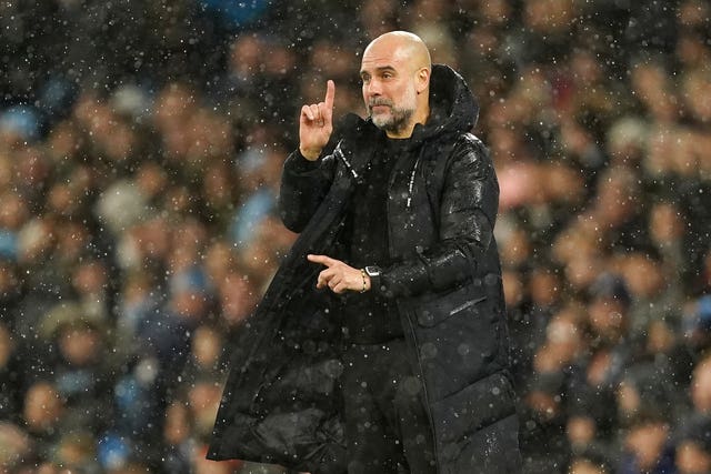 Pep Guardiola gestures on the touchline during Manchester City's FA Cup win over Newcastle