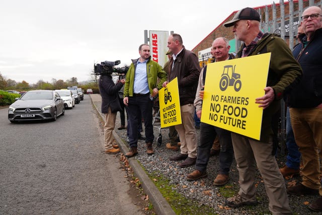 Farmers stage protest with placards