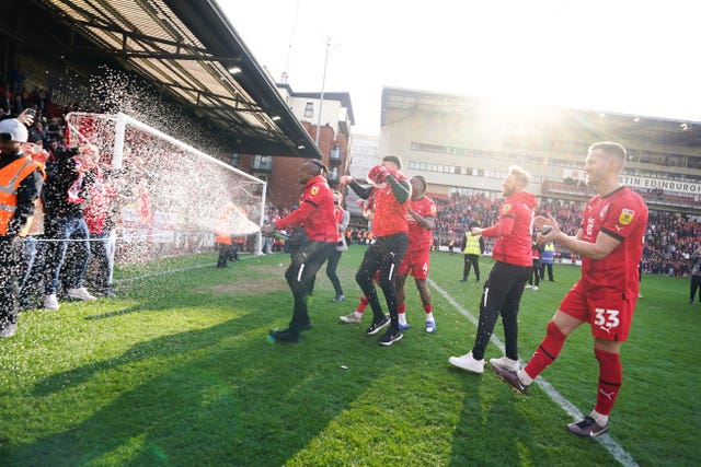 Leyton Orient players celebrate on the pitch
