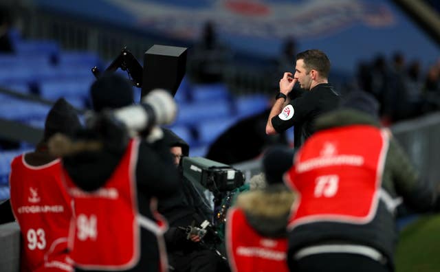 Referee Michael Oliver checked a pitchside monitor before sending off Crystal Palace midfielder Luka Milivojevic