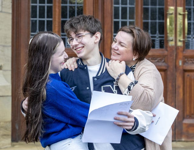 Oles Kuzomko with his sister Yaryna and mother Mila (Stephen Garnett Photography/Bradford Grammar School)