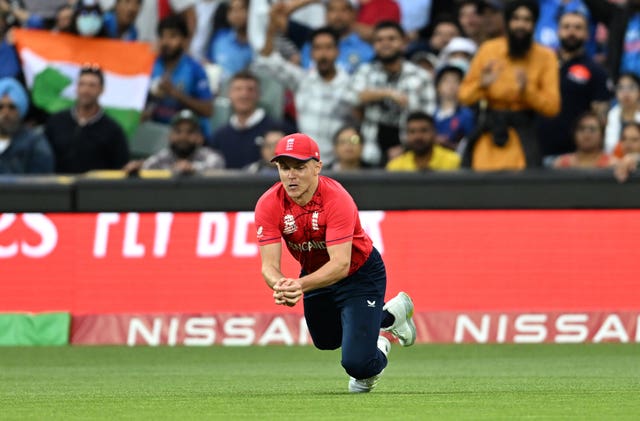 England's Sam Curran takes a catch to dismiss India’s Rohit Sharma