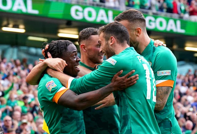 Republic of Ireland striker Michael Obafemi (left) celebrates with his team-mates after scoring the third goal in a 3-0 Nations League win over Scotland