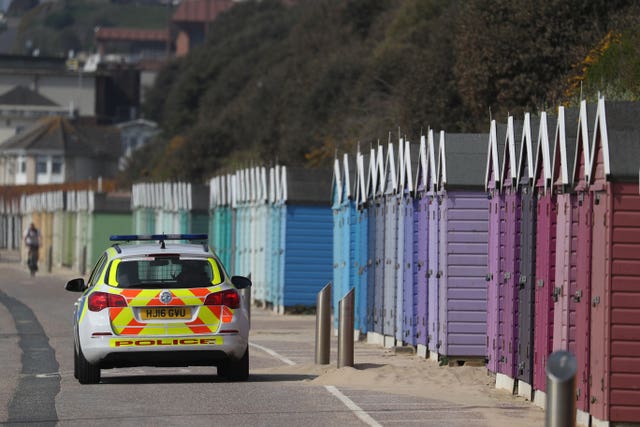 Police officers patrol the sea front in Bournemouth