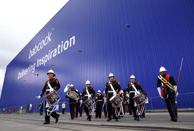 The Royal Marine Band leave The Venturer Building after a frigate steel cutting ceremony for the first of the class Type 31 frigate, at Babcock Rosyth, Fife 