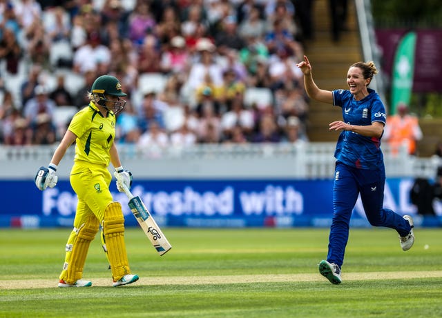 Kate Cross, right, celebrates bowling out Australia’s Alyssa Healy, left