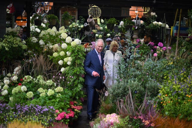Charles and Camilla also paid a to the central Paris Flower Market 