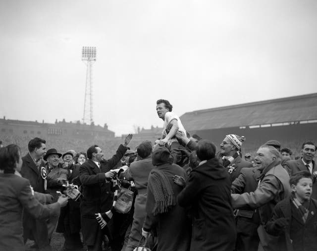 Billy Bingham is held aloft by fans after scoring the goal which sent Luton to the FA Cup final