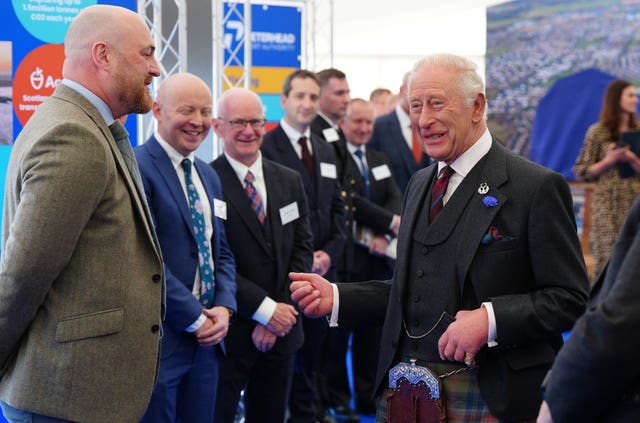 Charles wearing a kilt during a visit to Peterhead Port in Aberdeenshire