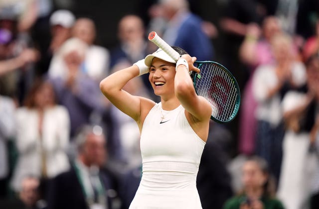 Emma Raducanu holds her hands and racket to her head in apparent amazement 