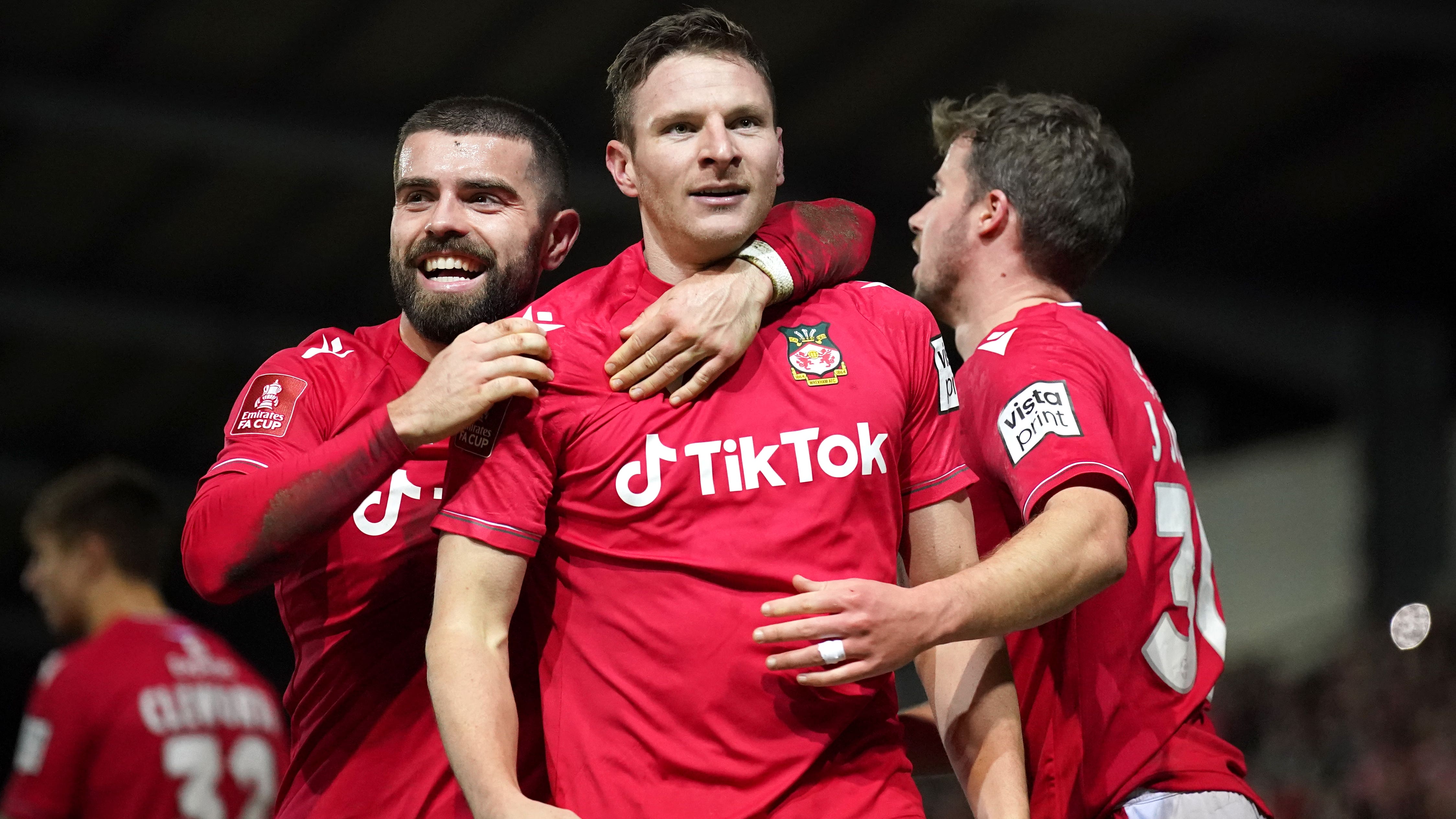Paul Mullin celebrates scoring Wrexham’s third goal of the game (Peter Byrne/PA)