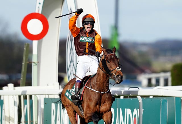 Jockey Sam Waley-Cohen celebrates winning the Grand National 