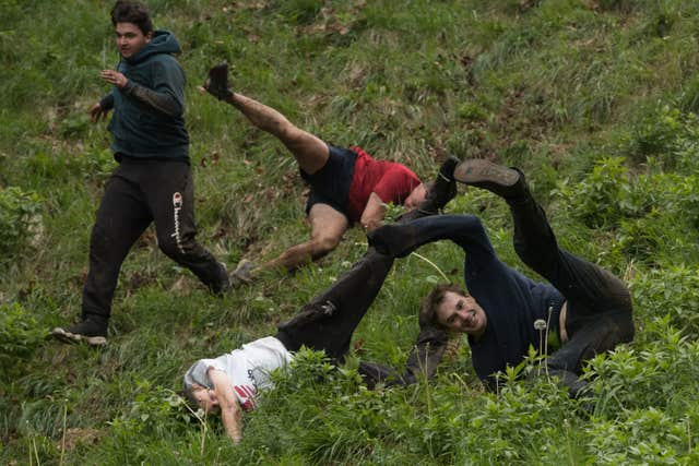 The cheese is chased 200 yards down the 1:2 gradient Cooper’s Hill at Brockworth (Aaron Chown/PA)