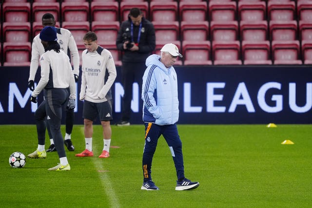 Carlo Ancelotti, with his hands in his pockets, walks during a Real Madrid training session