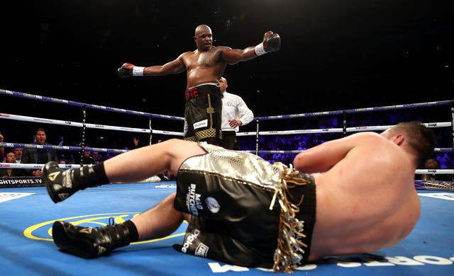 Dillian Whyte (back) knocks down Joseph Parker