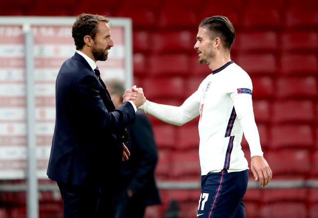 Jack Grealish (right) appeared in an England shirt five years after switching allegiance