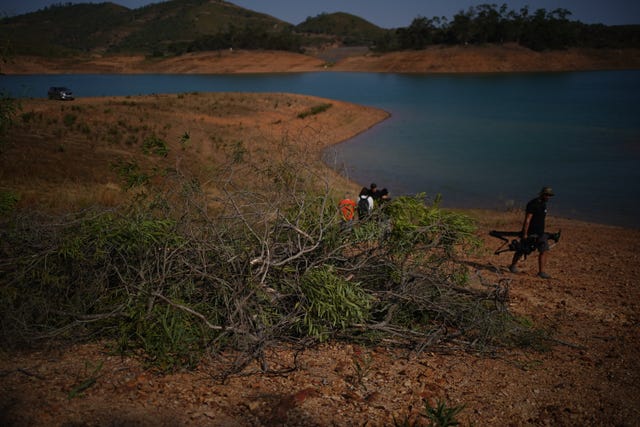 Personnel at Barragem do Arade reservoir in Portugal, as searches continue as part of the investigation into the disappearance of Madeleine McCann