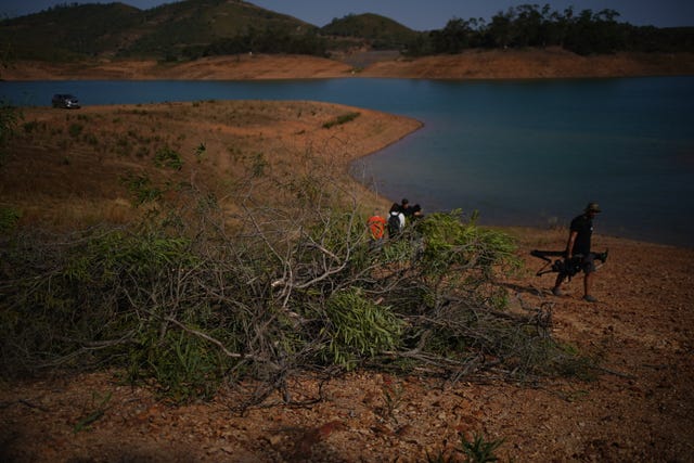 Personnel at Barragem do Arade reservoir in Portugal, as searches continue as part of the investigation into the disappearance of Madeleine McCann