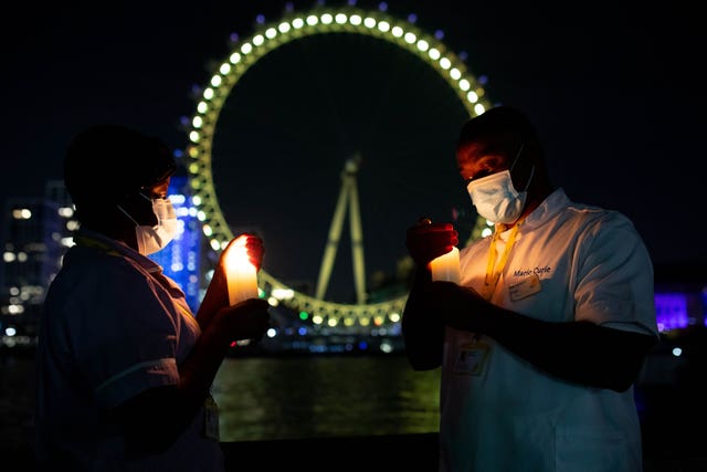 Nurses stand at the London Eye to mark Marie Curie’s inaugural National Day of Reflection