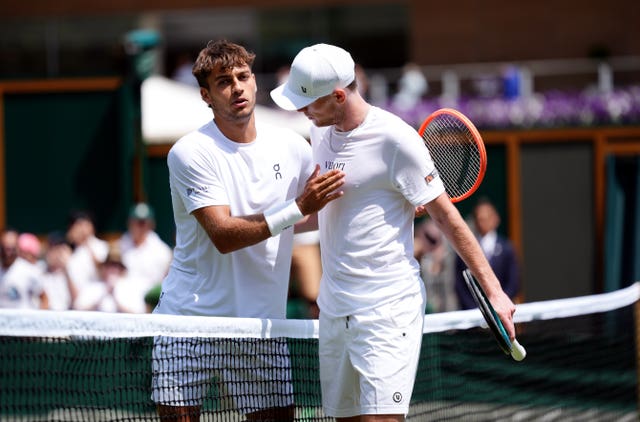 Jack Pinnington Jones, right, following his defeat to Flavio Cobolli