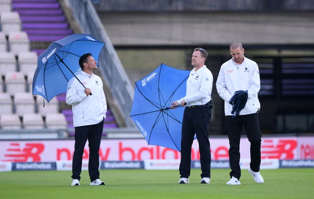 Umpires Richard Kettleborough, Martin Saggers and Michael Gough (left-right) inspect the pitch on day five of the second Test