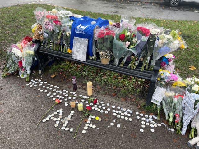 Tributes left on a bench on Broadgate Lane, Horsforth, following the incident