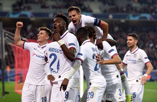 Willian is mobbed by his Chelsea team-mates after scoring