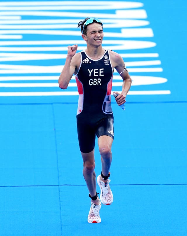 Alex Yee celebrates his silver medal on Monday