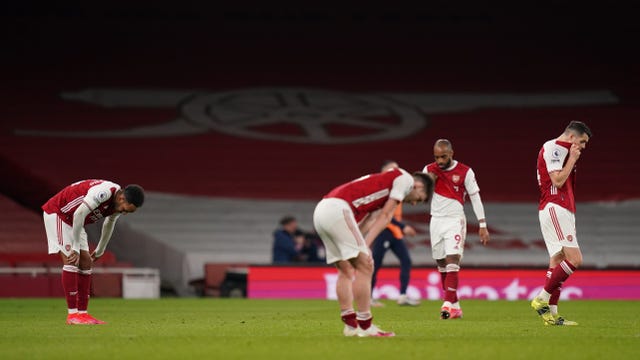 Arsenal''s players appear dejected after the final whistle