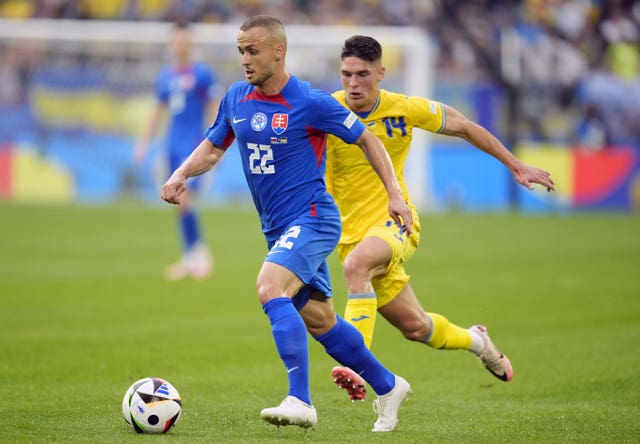 Stanislav Lobotka takes the ball against Ukraine 