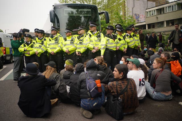 Police and protesters near the coach