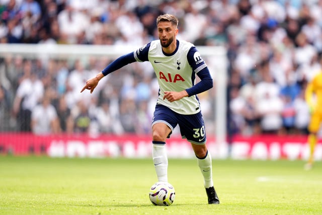 Rodrigo Bentancur dribbles the football