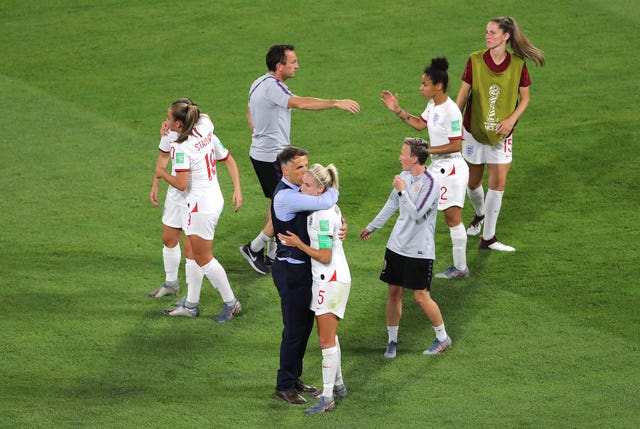 Neville comforts Houghton after the match in Lyon