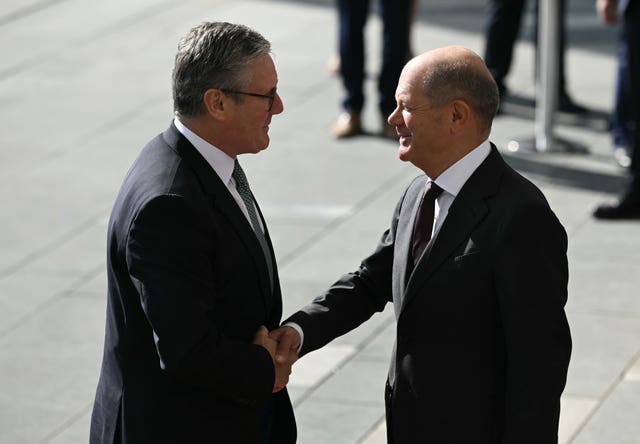 Sir Keir Starmer shakes hands with Olaf Scholz