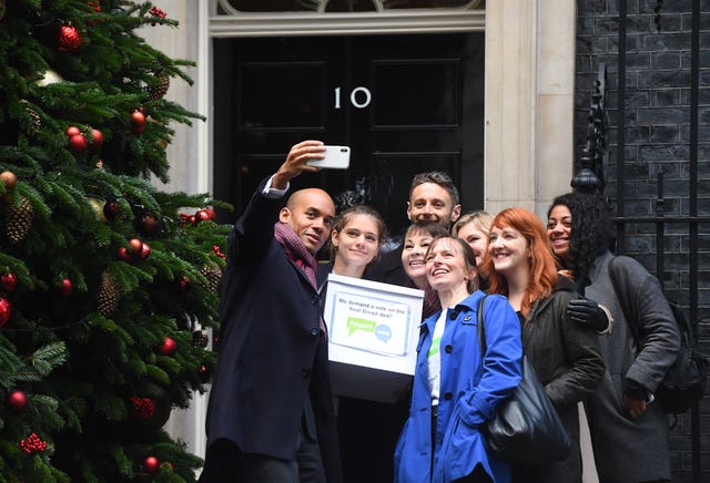Chuka Umunna takes a selfie while handing in Final Say and People's Vote petitions to 10 Downing Street
