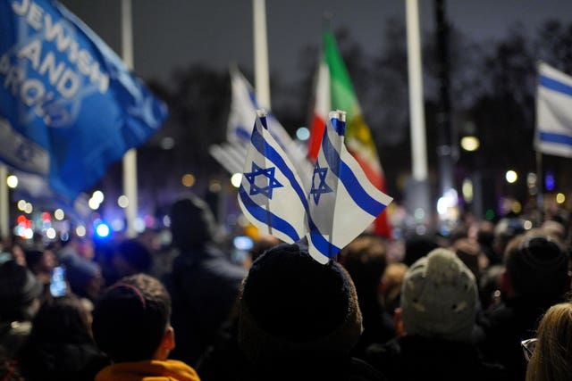 People attend a Campaign Against Antisemitism and Chabad UK event in Westminster to honour victims of a terrorist attack in Sydney, Australia