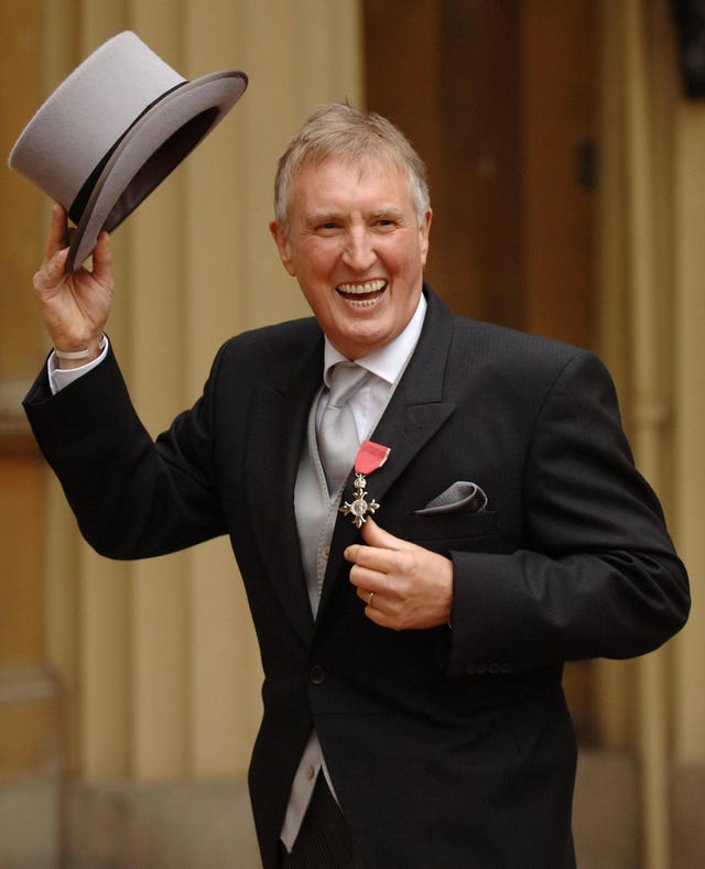 Johnnie Walker dressed and smiling for a visit to receive his honor 