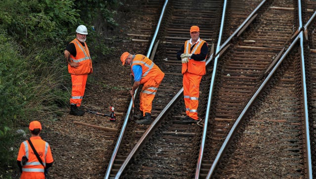 Network Rail workers carry out engineering maintenance on rail tracks