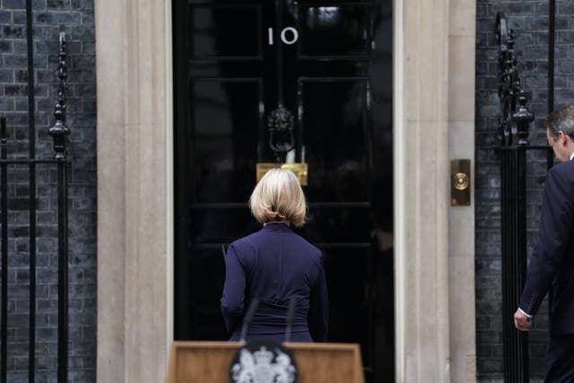 Liz Truss walking back into Downing Street after announcing her resignation