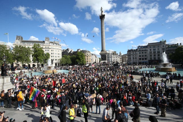 People gather in Trafalgar Square, London, after marching through central London following a Black Lives Matter rally in Hyde Park
