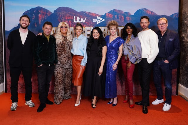 The cast of I’m A Celebrity... South Africa posing for a photo on a red carpet