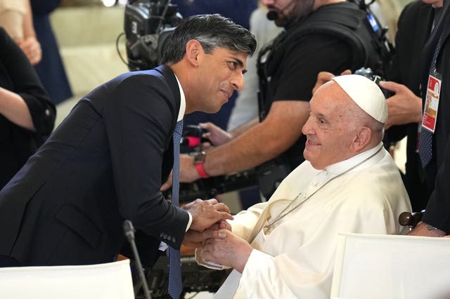 Rishi Sunak welcomes Pope Francis during the G7 leaders’ summit in Italy