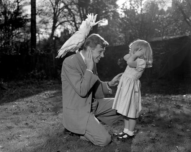 Sir David Attenborough with sulphur-crested cockatoo Georgie from New Guinea, which he visited for Zoo Quest 