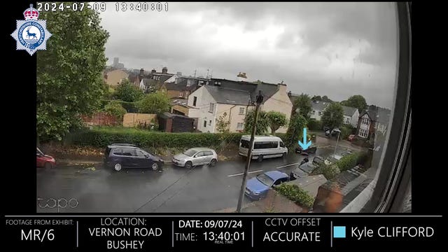 CCTV screengrab of Kyle Clifford parking his car in the streets near the family home of his ex-partner, Louise Hunt, before walking to the address in Bushey and knocking the door 